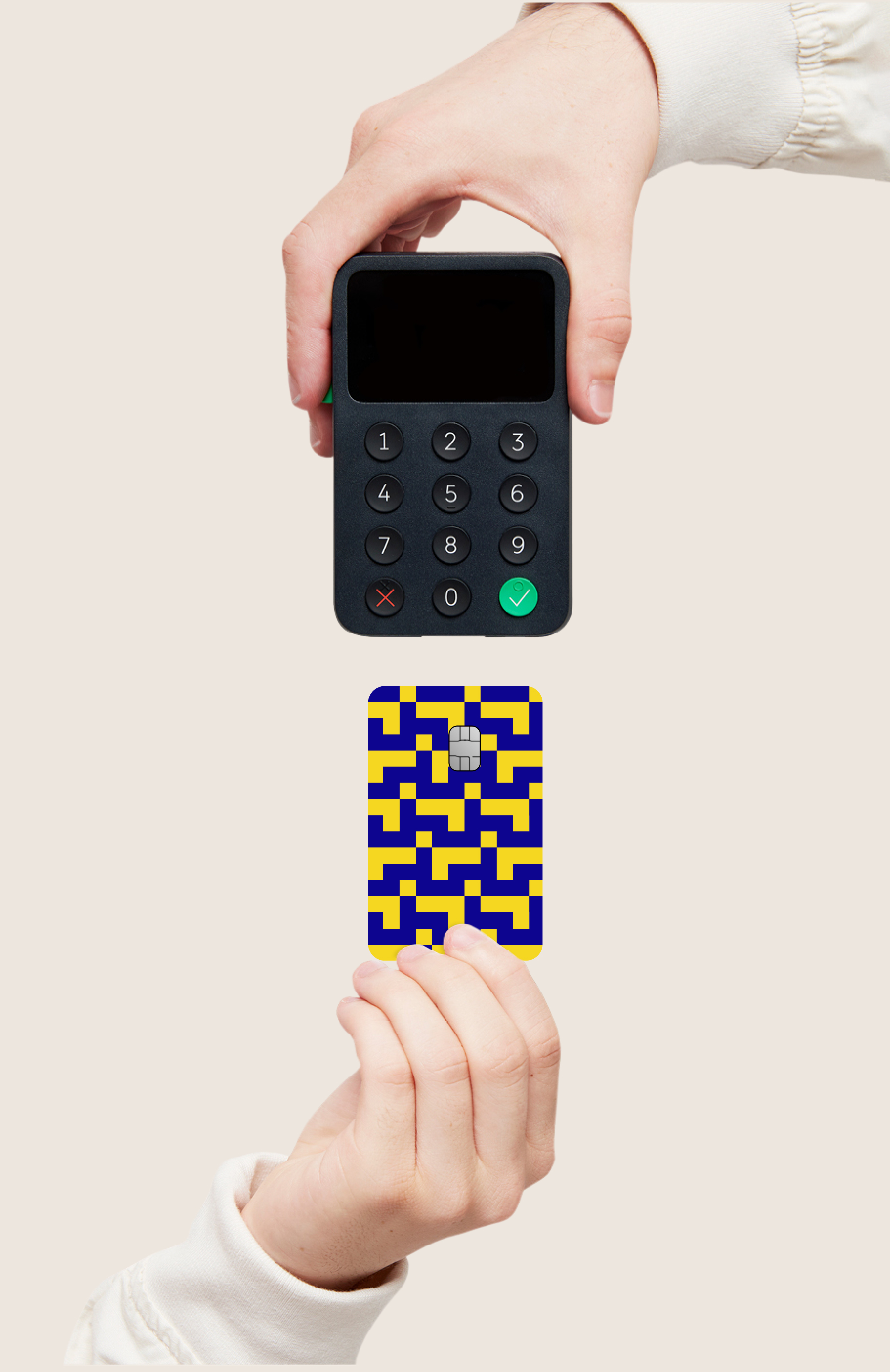 Hand holding a payment card to pay on a chip and pin payment processor